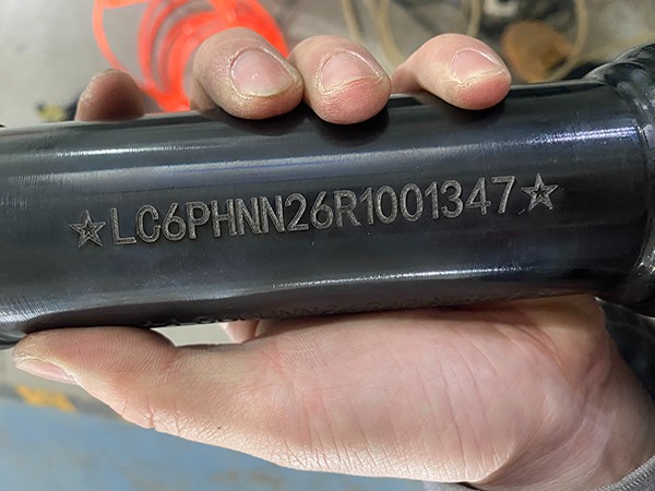 Results of deep laser VIN marking on a motorcycle frame